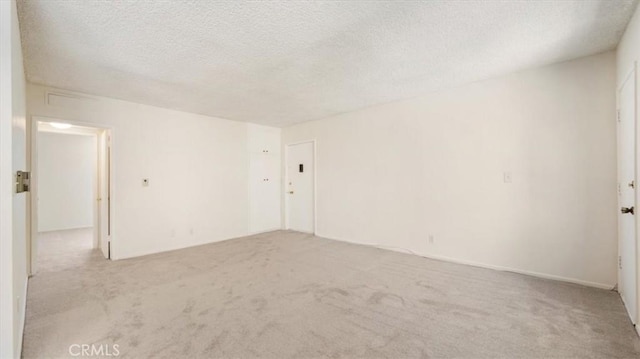 1115 Cordova St Unit 207, Pasadena, CA 91106 - empty room with light carpet and a textured ceiling