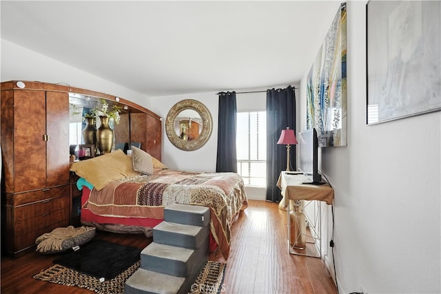 1750 Camino Palmero St Unit 539, Los Angeles, CA 90046 - bedroom featuring wood-type flooring and arched walkways