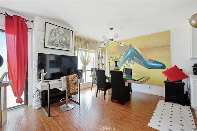 1750 Camino Palmero St Unit 539, Los Angeles, CA 90046 - dining room featuring a chandelier and wood finished floors