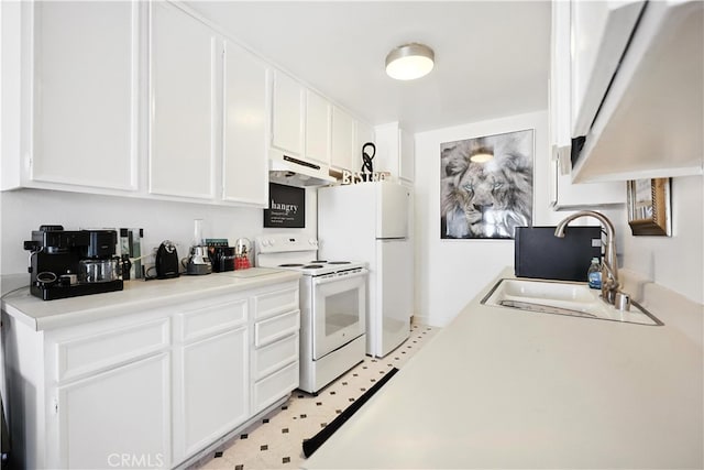 1750 Camino Palmero St Unit 539, Los Angeles, CA 90046 - kitchen with white appliances, under cabinet range hood, white cabinetry, light countertops, and light flooring