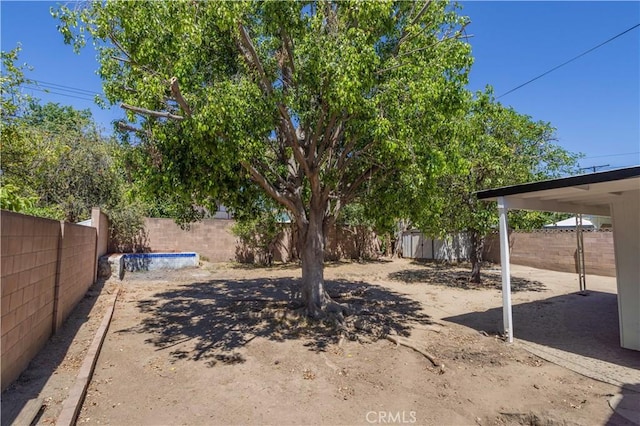 8825 Sophia Ave, North Hills, CA 91343 - fenced backyard featuring a storage unit