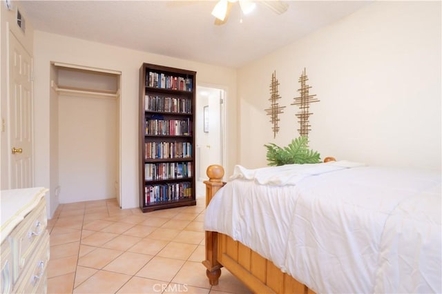 8825 Sophia Ave, North Hills, CA 91343 - bedroom with light tile patterned floors and ceiling fan
