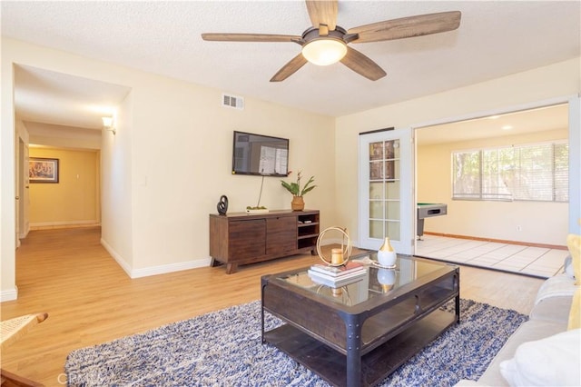 8825 Sophia Ave, North Hills, CA 91343 - living room with wood finished floors and ceiling fan