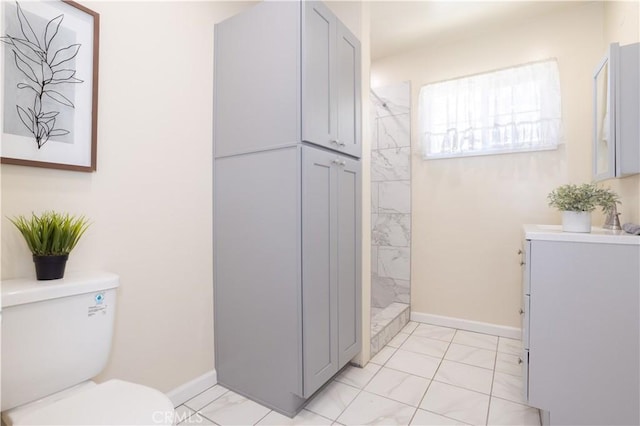8825 Sophia Ave, North Hills, CA 91343 - full bathroom with marble look tile flooring, vanity, and tiled shower