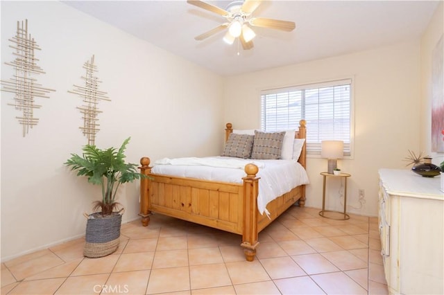 8825 Sophia Ave, North Hills, CA 91343 - bedroom with light tile patterned floors and a ceiling fan
