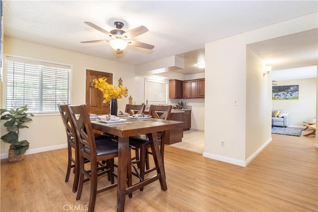 8825 Sophia Ave, North Hills, CA 91343 - dining space featuring light wood-style flooring and ceiling fan