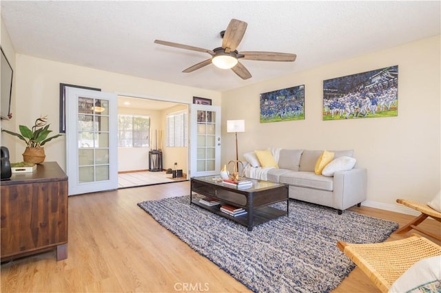 8825 Sophia Ave, North Hills, CA 91343 - living room with light wood finished floors and a ceiling fan