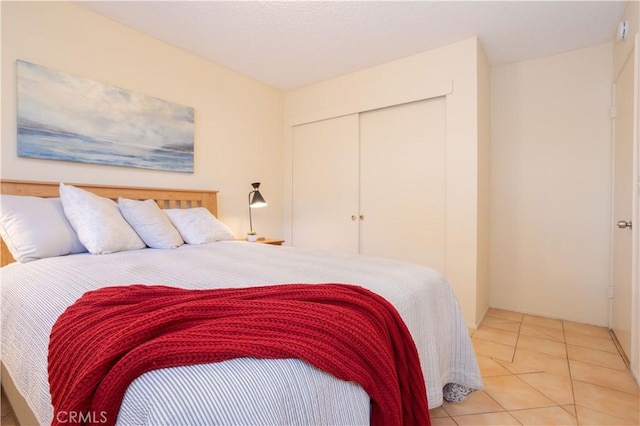 8825 Sophia Ave, North Hills, CA 91343 - bedroom with a closet and light tile patterned flooring