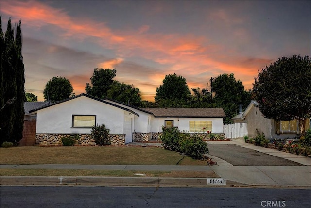 8825 Sophia Ave, North Hills, CA 91343 - single story home with stucco siding, concrete driveway, and stone siding