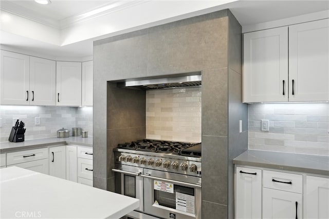 20455 Via Canarias, Yorba Linda, CA 92887 - kitchen with range with two ovens, decorative backsplash, ornamental molding, range hood, and white cabinetry