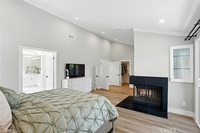 20455 Via Canarias, Yorba Linda, CA 92887 - bedroom featuring crown molding, light wood-style flooring, high vaulted ceiling, recessed lighting, and a spacious closet