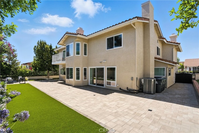 20455 Via Canarias, Yorba Linda, CA 92887 - back of property featuring a chimney, a balcony, stucco siding, and a tile roof