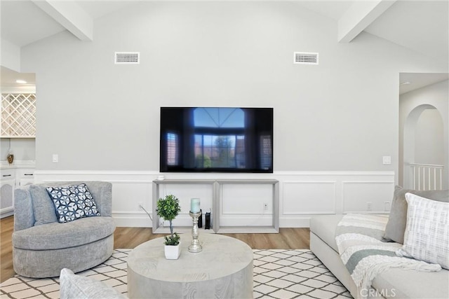 20455 Via Canarias, Yorba Linda, CA 92887 - living room featuring beamed ceiling, light wood finished floors, a wainscoted wall, and high vaulted ceiling