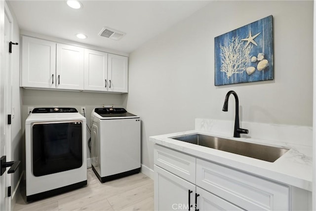 20455 Via Canarias, Yorba Linda, CA 92887 - laundry room with washer and clothes dryer, cabinet space, recessed lighting, and light wood-style flooring
