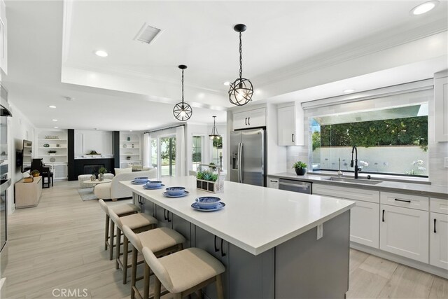 20455 Via Canarias, Yorba Linda, CA 92887 - kitchen with appliances with stainless steel finishes, crown molding, recessed lighting, a center island, and plenty of natural light