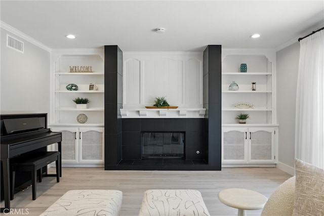 20455 Via Canarias, Yorba Linda, CA 92887 - living room featuring light wood finished floors, ornamental molding, a fireplace, and recessed lighting