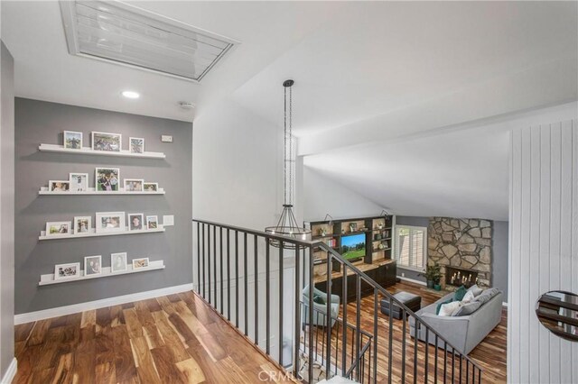 25632 Adriana St, Mission Viejo, CA 92691 - corridor featuring wood finished floors and an upstairs landing