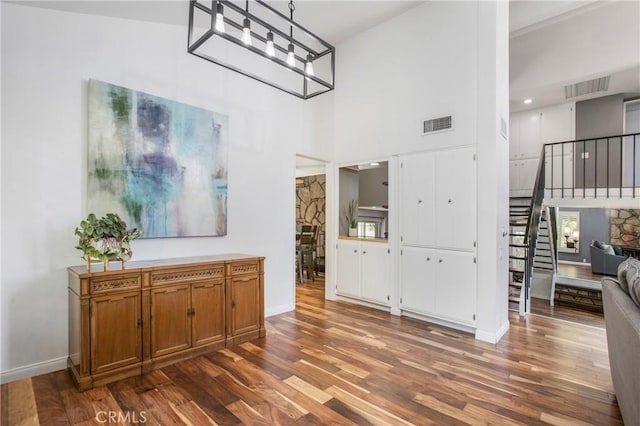 25632 Adriana St, Mission Viejo, CA 92691 - entryway featuring stairway, wood finished floors, and a towering ceiling