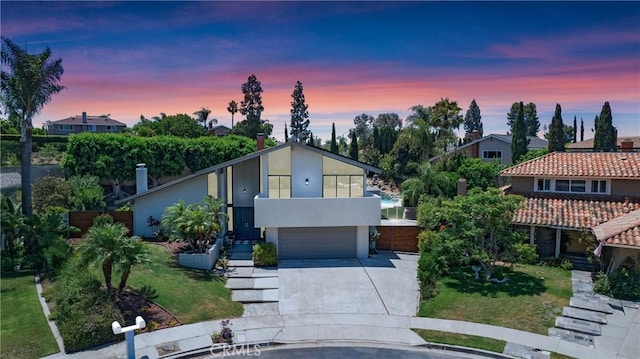 25632 Adriana St, Mission Viejo, CA 92691 - view of front of home featuring driveway, an attached garage, stucco siding, and a front yard