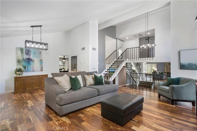 25632 Adriana St, Mission Viejo, CA 92691 - living room with high vaulted ceiling, a chandelier, stairway, and dark wood-style flooring