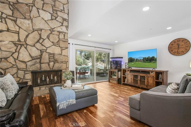 25632 Adriana St, Mission Viejo, CA 92691 - living area featuring wood finished floors, a stone fireplace, and recessed lighting