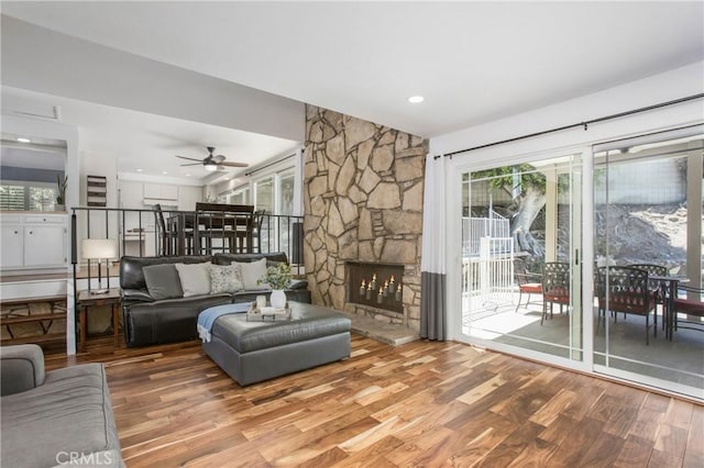 25632 Adriana St, Mission Viejo, CA 92691 - living room with wood finished floors, a stone fireplace, and ceiling fan