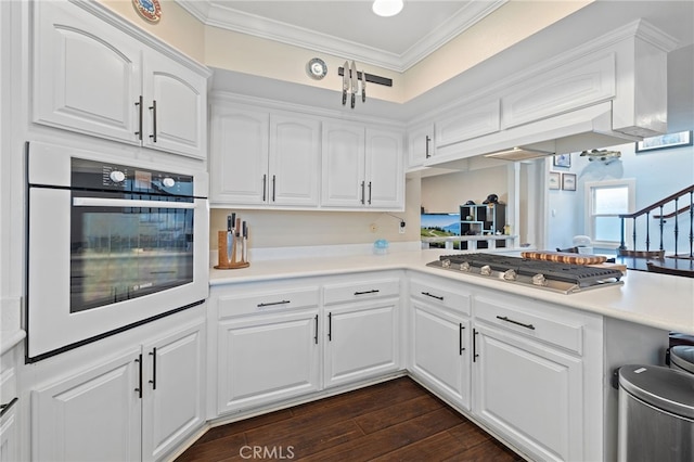 2115 Kathryn Way, Placentia, CA 92870 - kitchen featuring oven, stainless steel gas stovetop, ornamental molding, white cabinets, and light countertops