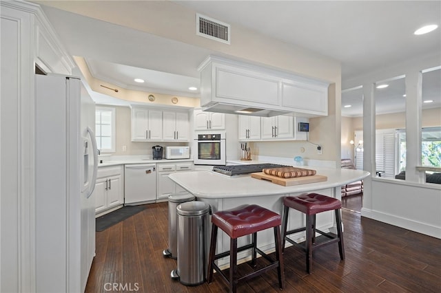 2115 Kathryn Way, Placentia, CA 92870 - kitchen featuring appliances with stainless steel finishes, white cabinets, light countertops, plenty of natural light, and recessed lighting
