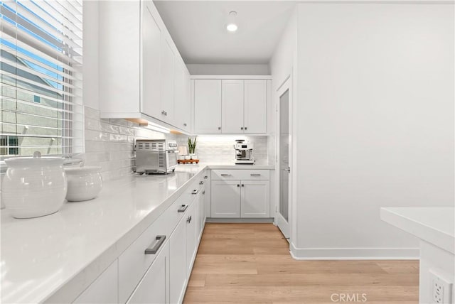 90 Harness Way, Rancho Mission Viejo, CA 92694 - kitchen featuring decorative backsplash, light wood finished floors, white cabinetry, light countertops, and recessed lighting