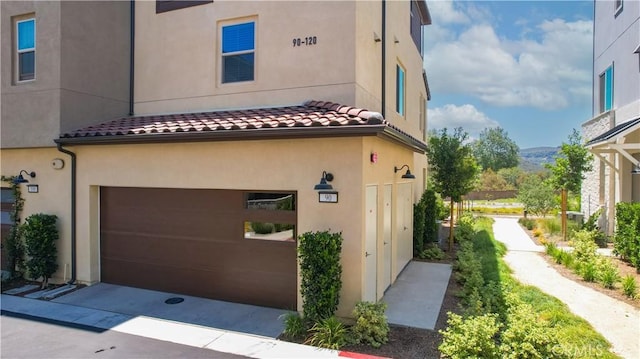 90 Harness Way, Rancho Mission Viejo, CA 92694 - view of property exterior with a tiled roof, stucco siding, and an attached garage