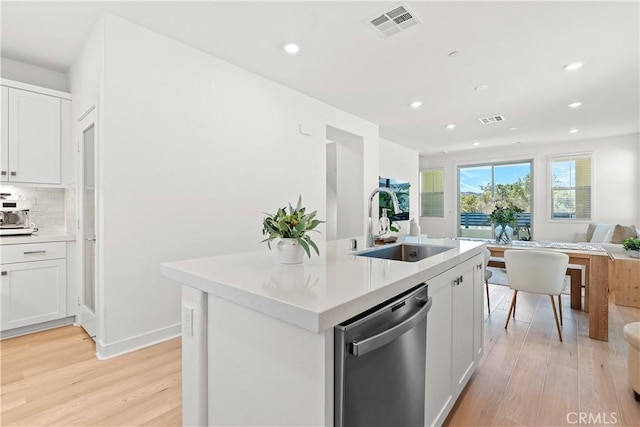 90 Harness Way, Rancho Mission Viejo, CA 92694 - kitchen featuring stainless steel dishwasher, light wood finished floors, open floor plan, light countertops, and recessed lighting