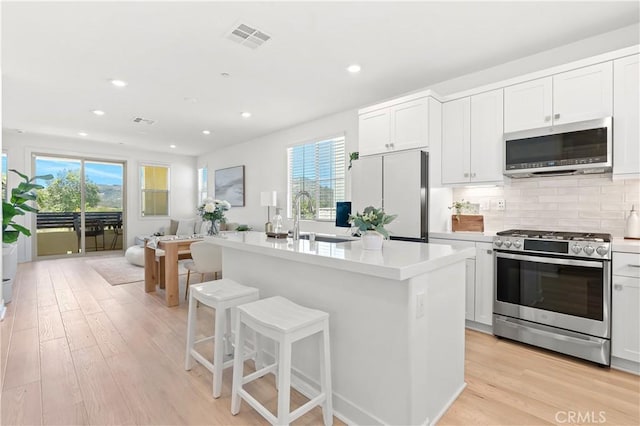 90 Harness Way, Rancho Mission Viejo, CA 92694 - kitchen with stainless steel appliances, light wood-style floors, healthy amount of natural light, and recessed lighting