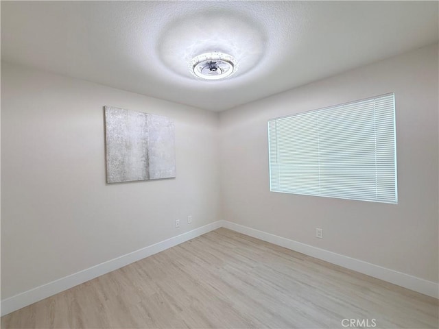 1421 Wildflower St, Rialto, CA 92377 - empty room with light wood finished floors and baseboards
