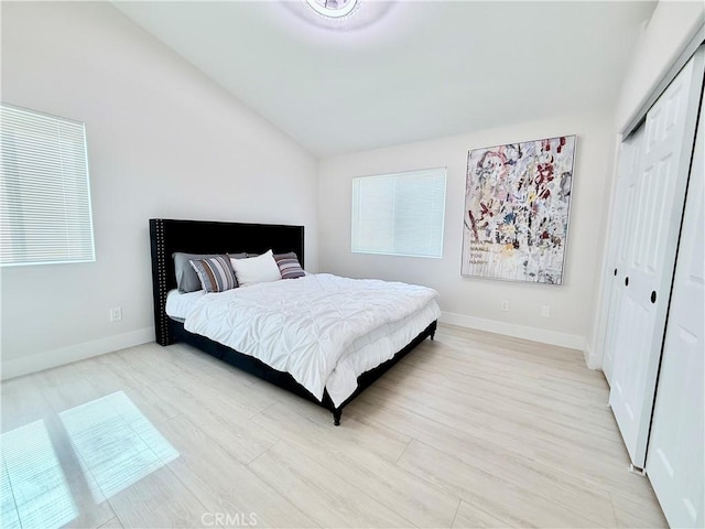 1421 Wildflower St, Rialto, CA 92377 - bedroom featuring light wood finished floors, vaulted ceiling, and a closet
