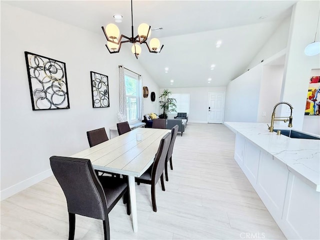 1421 Wildflower St, Rialto, CA 92377 - dining area with lofted ceiling, a chandelier, light wood-style floors, and recessed lighting