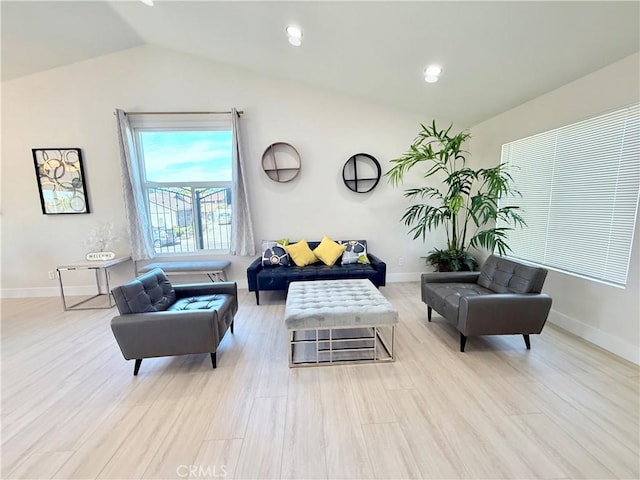 1421 Wildflower St, Rialto, CA 92377 - living area with lofted ceiling and light wood-style flooring