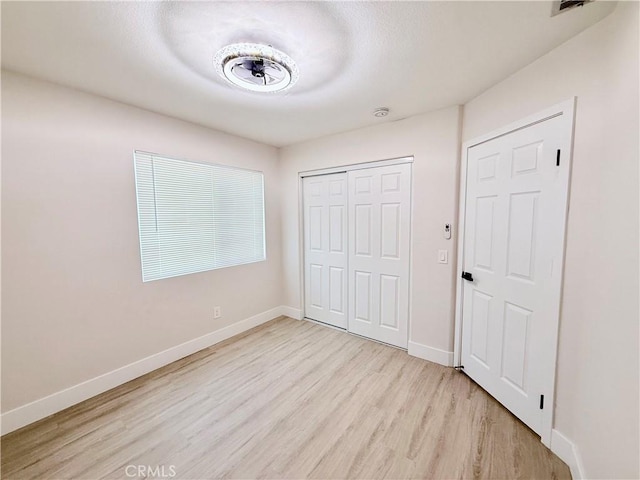 1421 Wildflower St, Rialto, CA 92377 - unfurnished bedroom with light wood finished floors and a closet