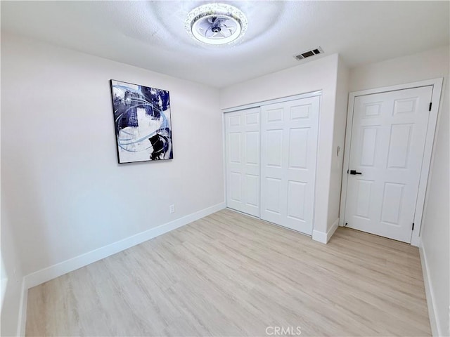 1421 Wildflower St, Rialto, CA 92377 - unfurnished bedroom with light wood finished floors and a closet