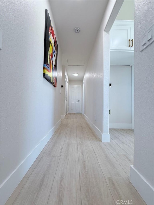 1421 Wildflower St, Rialto, CA 92377 - corridor featuring light wood-type flooring and baseboards
