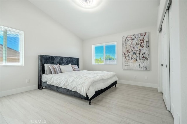 1421 Wildflower St, Rialto, CA 92377 - bedroom featuring multiple windows, lofted ceiling, light wood-type flooring, and a closet