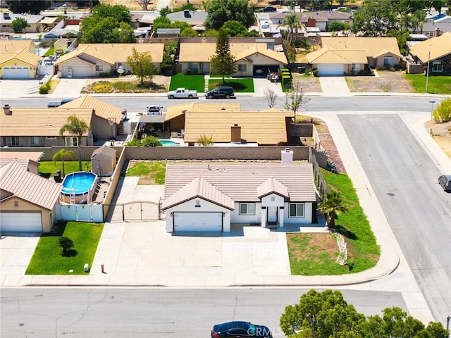 1421 Wildflower St, Rialto, CA 92377 - aerial perspective of suburban area with a pool area