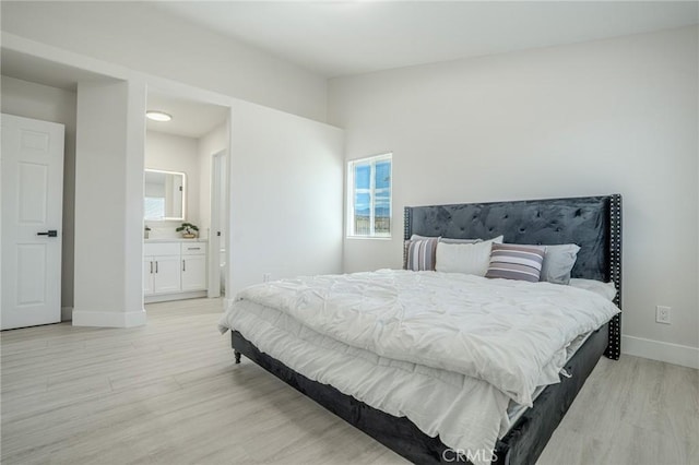 1421 Wildflower St, Rialto, CA 92377 - bedroom featuring light wood-style flooring, multiple windows, and ensuite bath