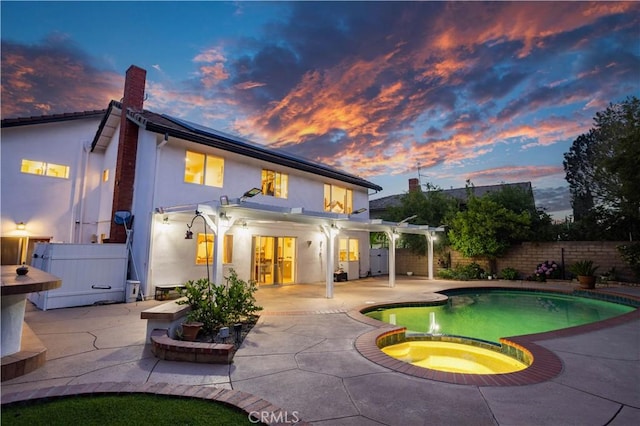 11721 Killimore Ave, Porter Ranch, CA 91326 - back of house with stucco siding, french doors, a patio area, a fenced backyard, and a pergola