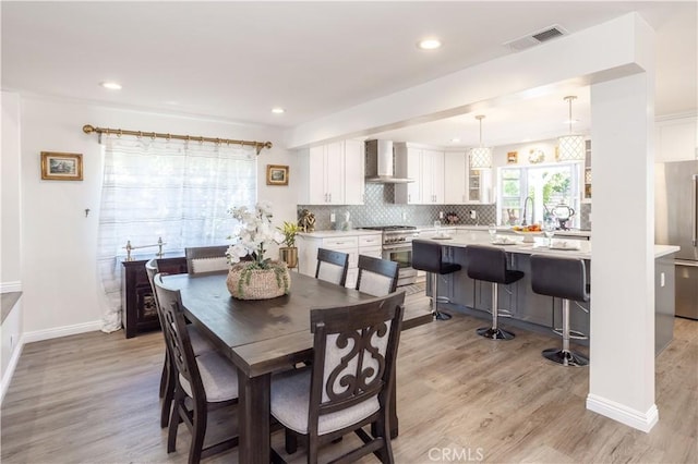 11721 Killimore Ave, Porter Ranch, CA 91326 - dining space featuring light wood-style flooring and recessed lighting