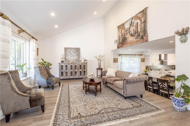 11721 Killimore Ave, Porter Ranch, CA 91326 - living area with light wood-style floors, plenty of natural light, high vaulted ceiling, and recessed lighting