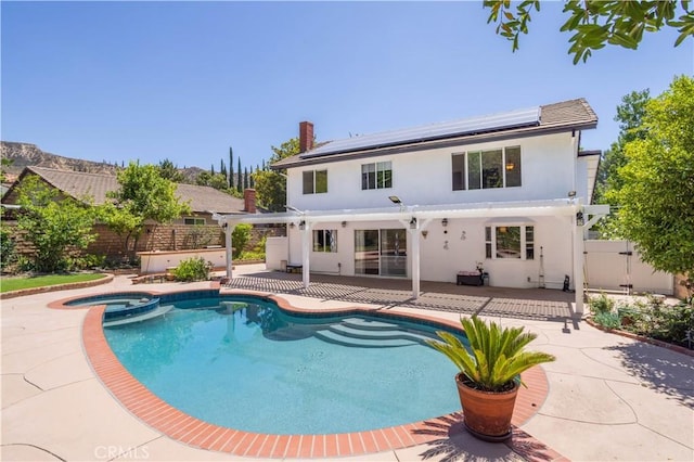 11721 Killimore Ave, Porter Ranch, CA 91326 - view of pool featuring a pergola, a fenced backyard, a patio, a pool with connected hot tub, and a gate