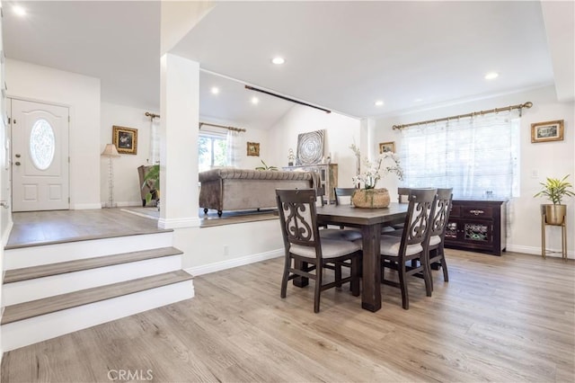 11721 Killimore Ave, Porter Ranch, CA 91326 - dining space featuring wood finished floors, vaulted ceiling, and recessed lighting