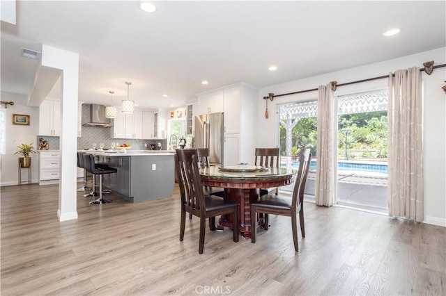 11721 Killimore Ave, Porter Ranch, CA 91326 - dining space featuring light wood finished floors and recessed lighting