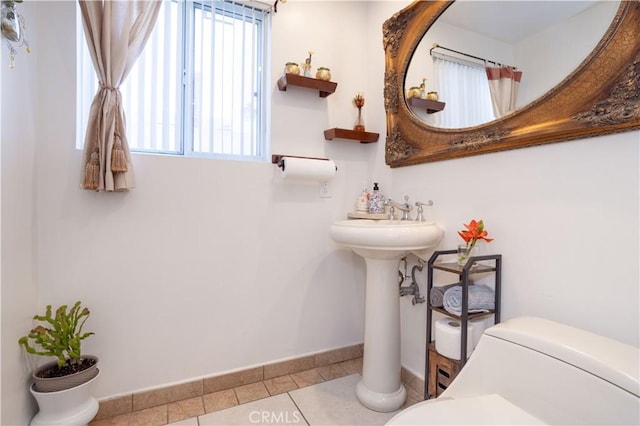 11721 Killimore Ave, Porter Ranch, CA 91326 - bathroom featuring baseboards and tile patterned flooring