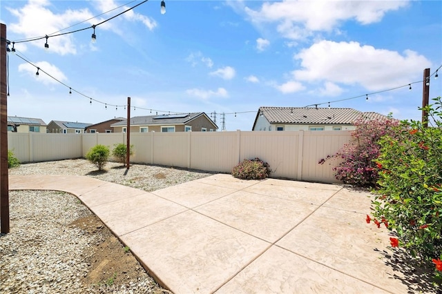 1415 Opal Ct, Beaumont, CA 92223 - fenced backyard with a patio area